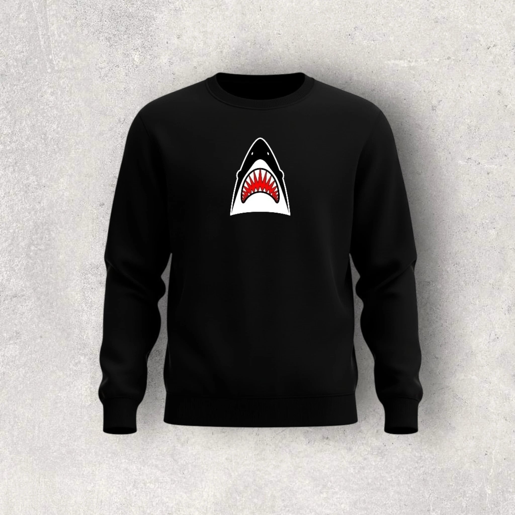 Black sweatshirt with a shark graphic on a gray background