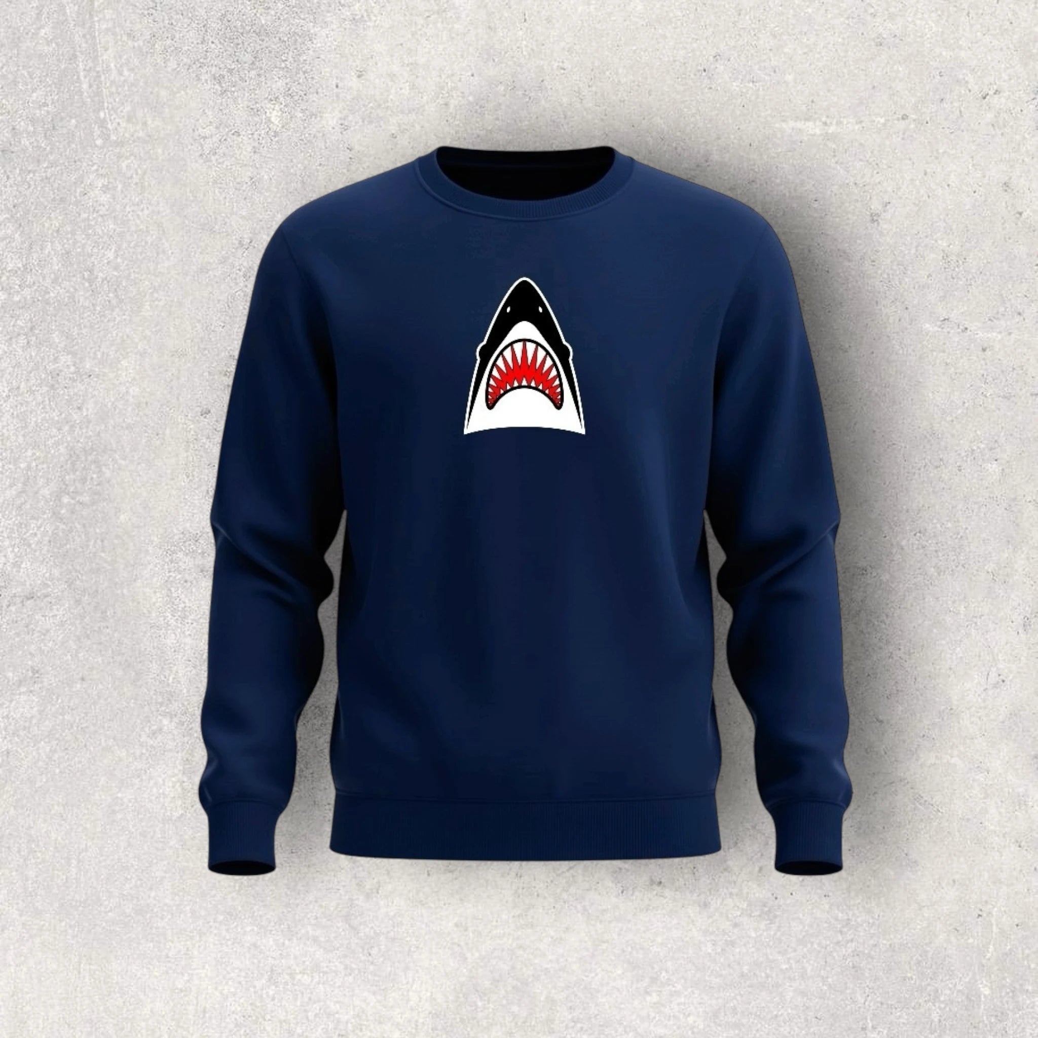 Navy blue sweatshirt with a shark graphic on a light gray background