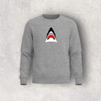 Gray sweatshirt with a shark graphic on a textured gray background