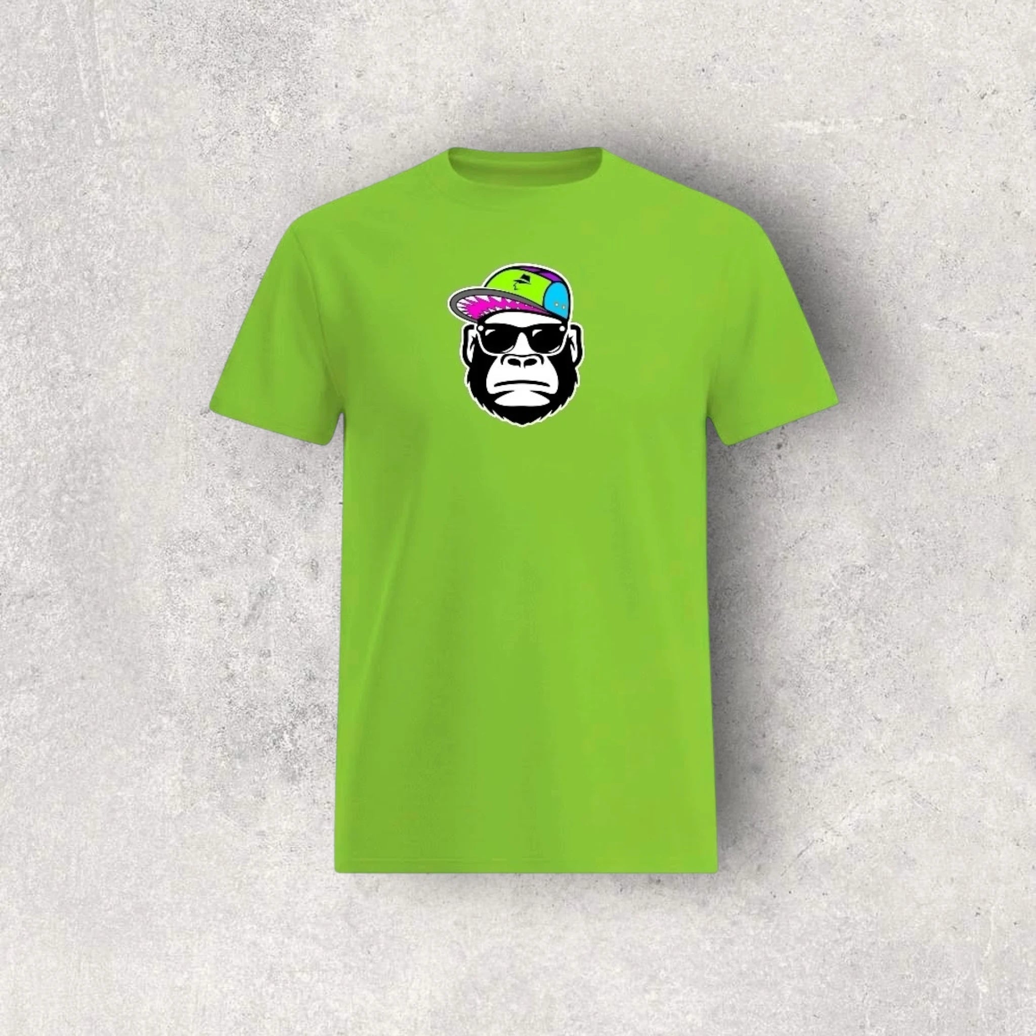 Green t-shirt with a graphic of a monkey wearing sunglasses and a hat on a textured gray background