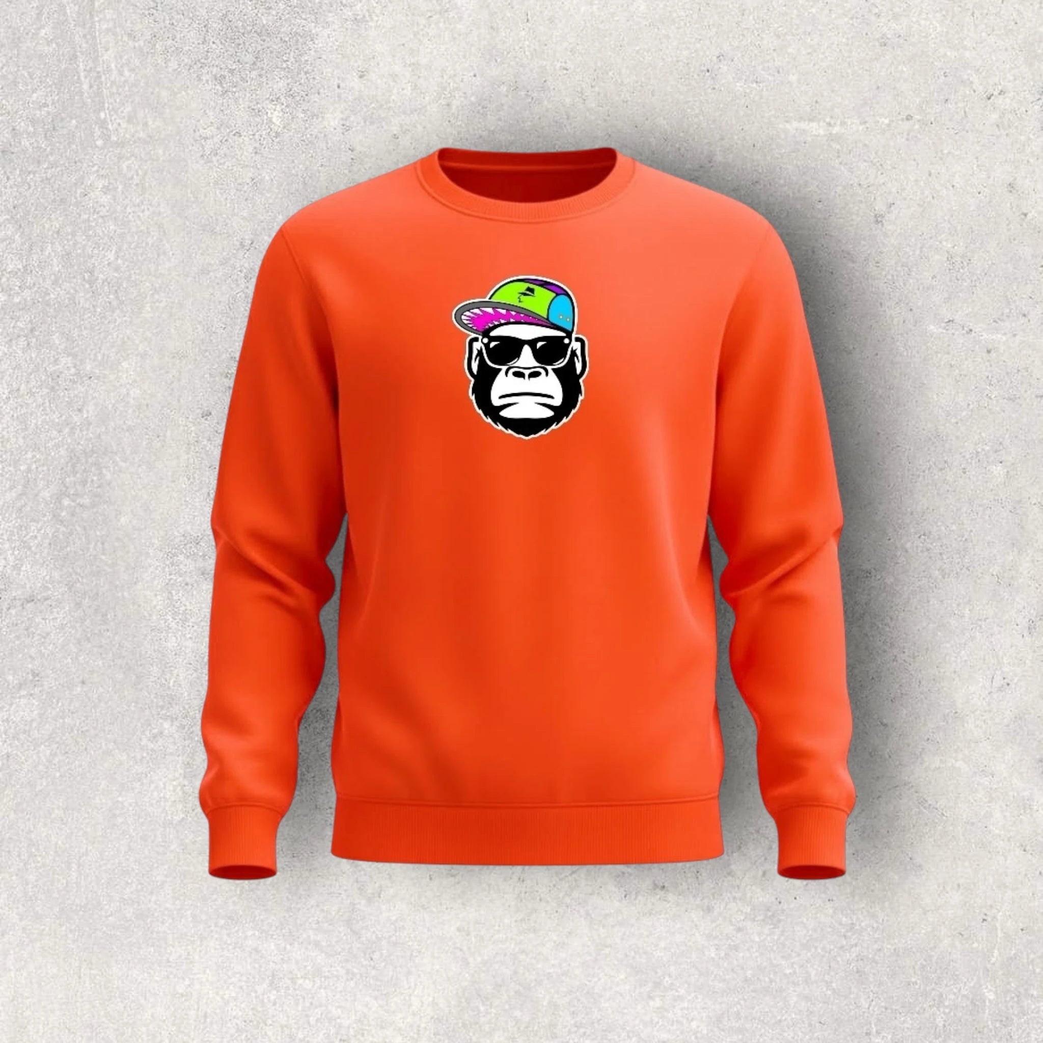 Orange sweatshirt with a graphic of a monkey wearing sunglasses and a colorful hat on a gray background