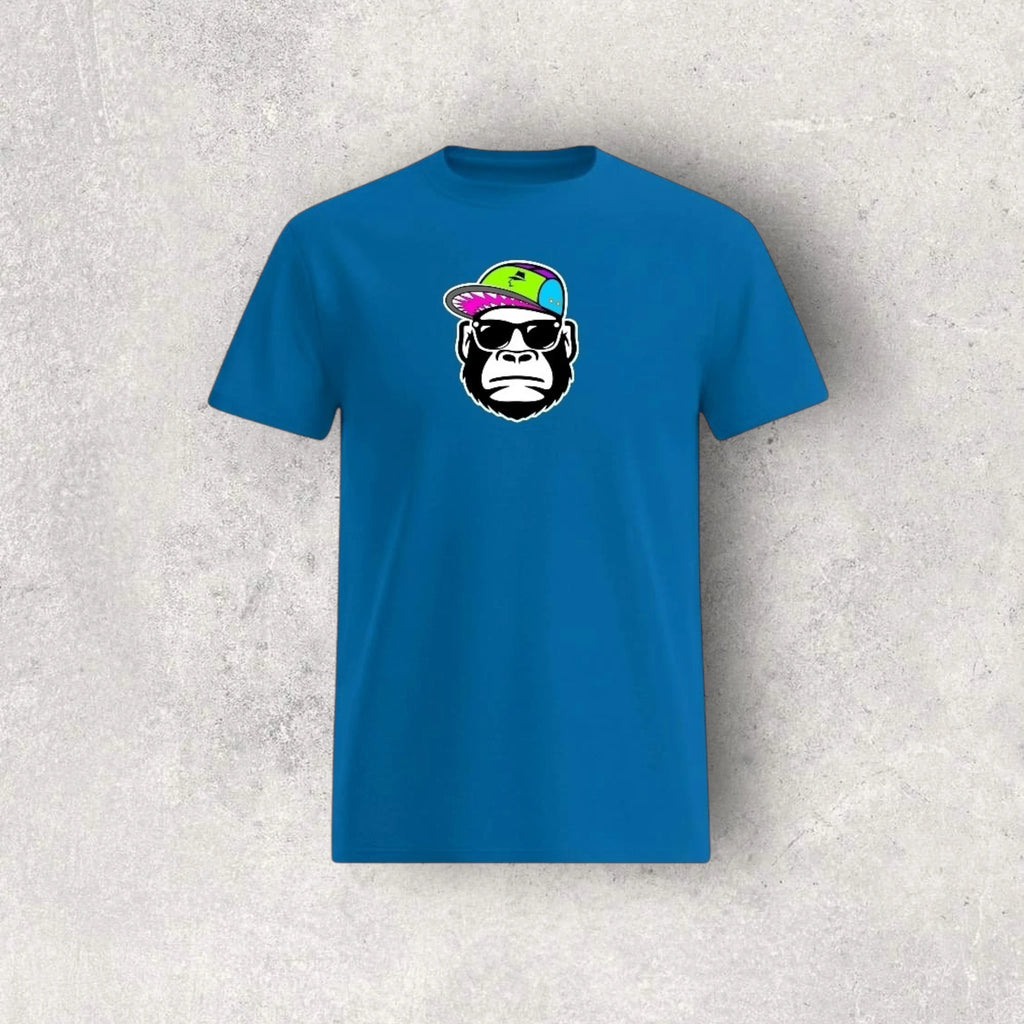 Blue t-shirt with a graphic of a monkey wearing sunglasses and a colorful hat on a textured gray background.