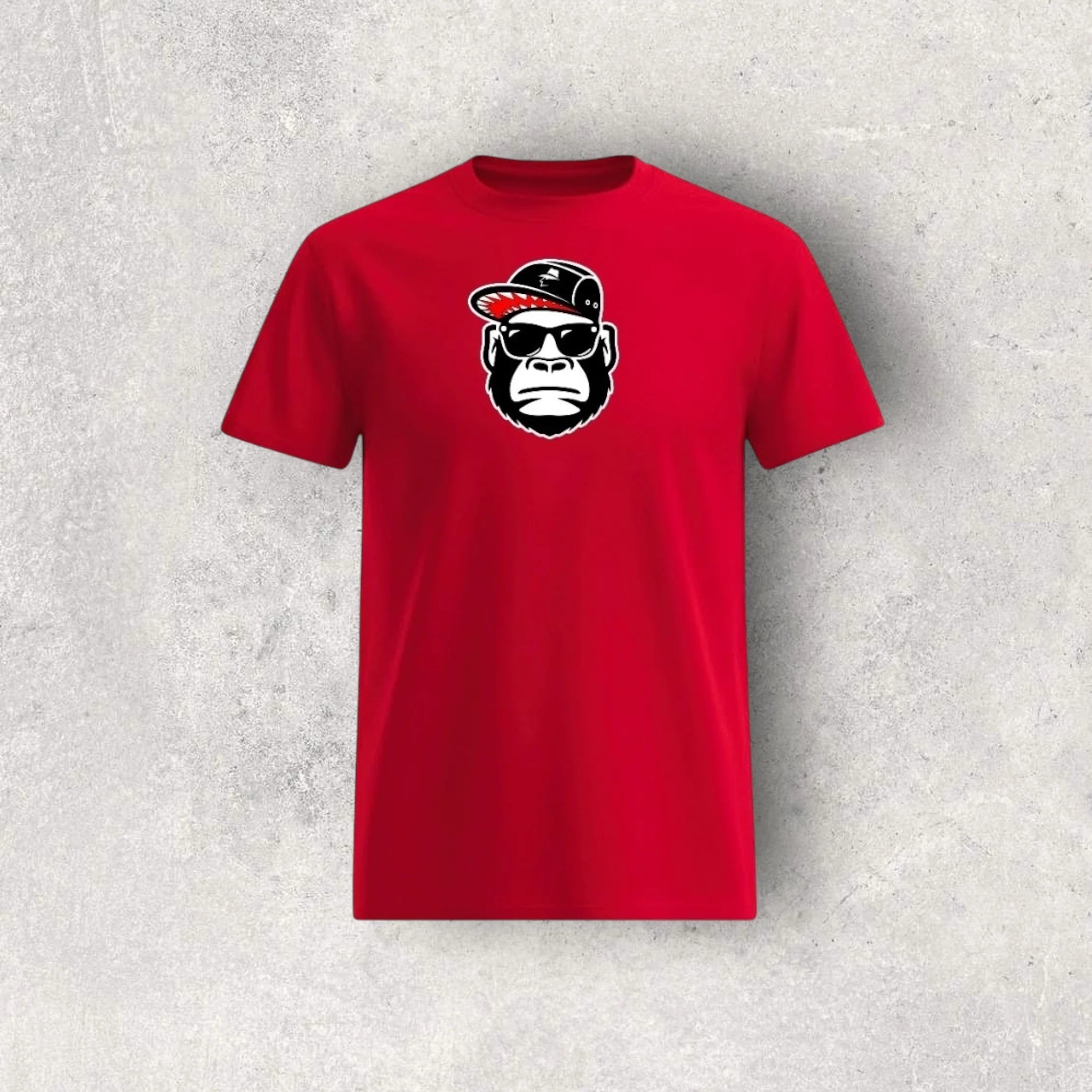 Red t-shirt with a graphic of a monkey wearing sunglasses and a cap on a gray background