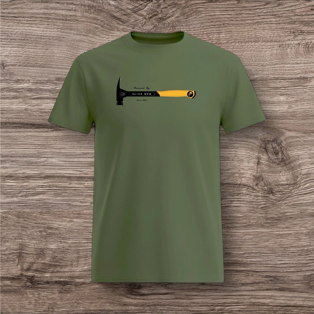 Green t-shirt with a hammer graphic on a wooden surface