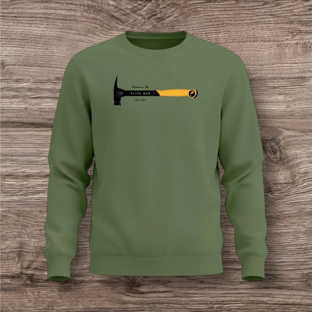 Green sweatshirt with a hammer graphic on a wooden surface