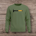 Green sweatshirt with a hammer graphic on a wooden surface