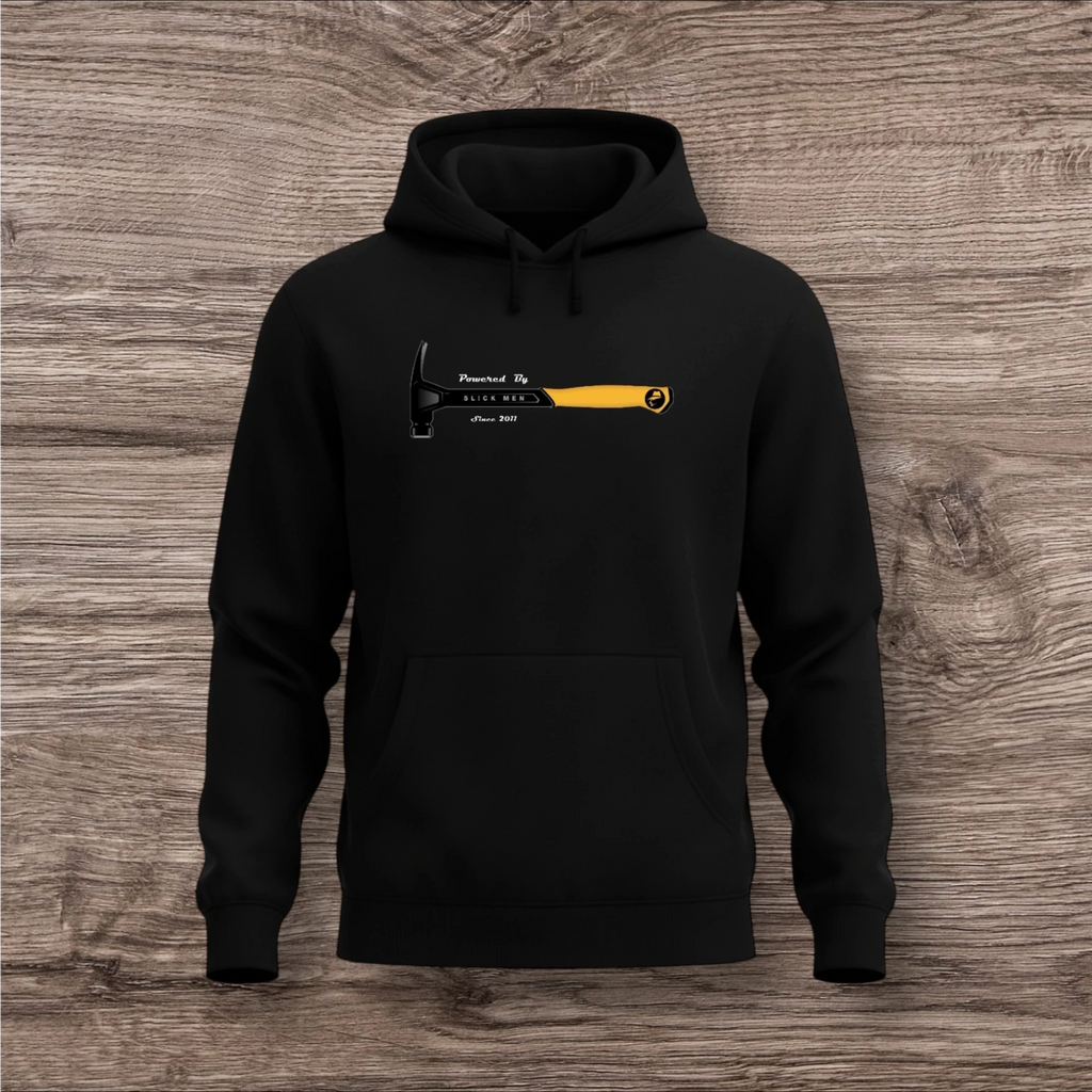 Black hoodie with a hammer graphic and text on a wooden surface