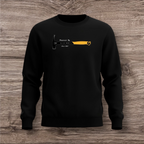 Black sweatshirt with a hammer graphic and text on a wooden surface