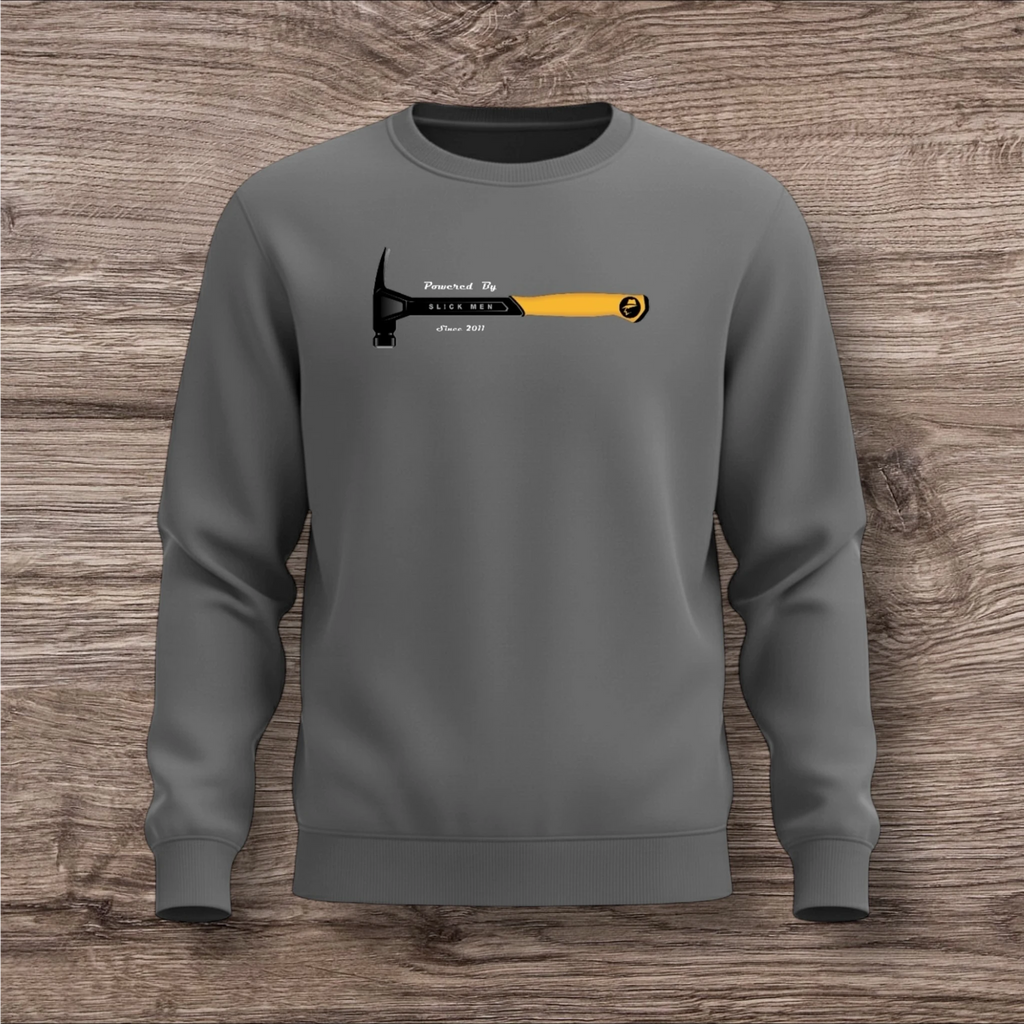 Gray sweatshirt with a hammer design on a wooden surface