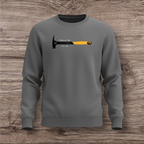 Gray sweatshirt with a hammer design on a wooden surface