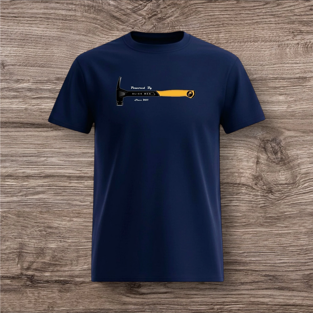 Navy blue t-shirt with a hammer graphic and text on a wooden surface