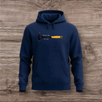 Navy blue hoodie with a hammer graphic and text on a wooden surface