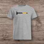 Gray t-shirt with a hammer graphic and text on a wooden surface