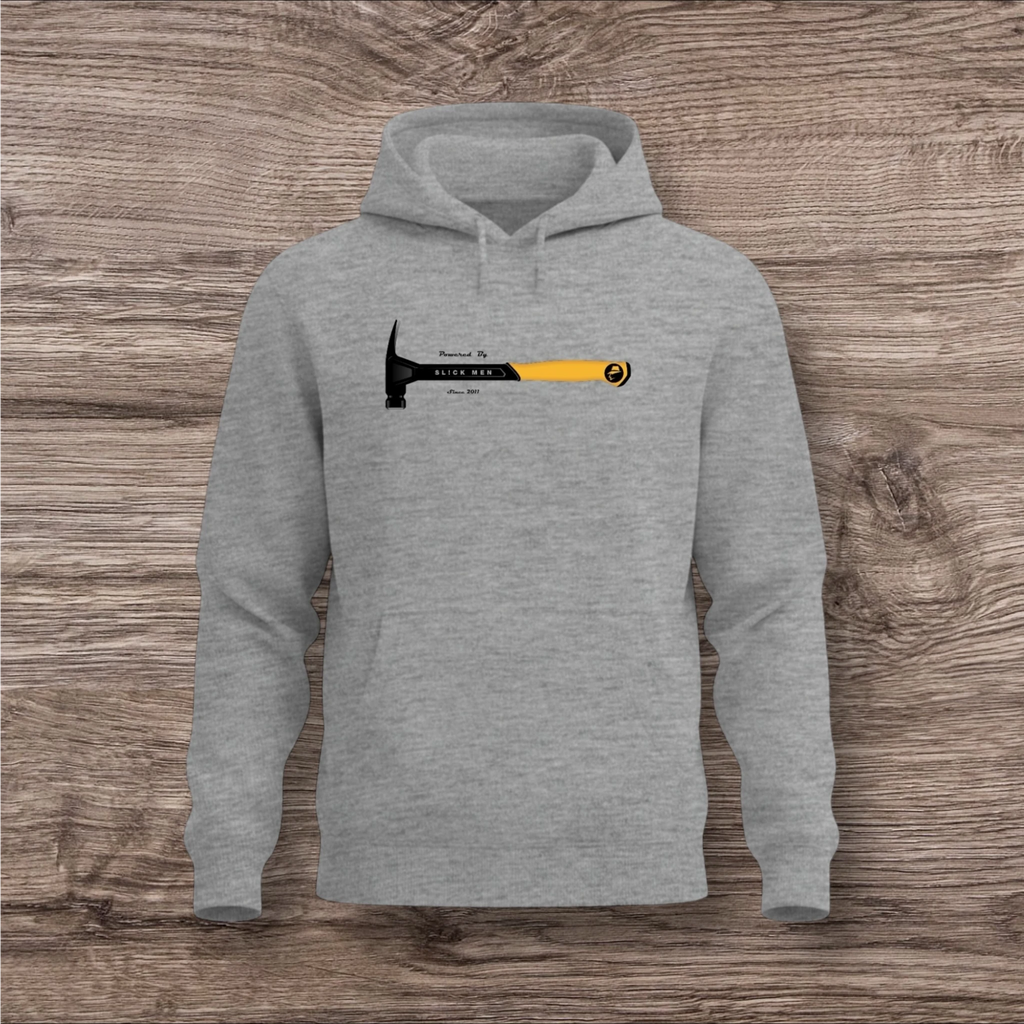Gray hoodie with a hammer graphic and text on a wooden surface