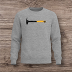 Gray sweatshirt with a hammer graphic and text on a wooden surface