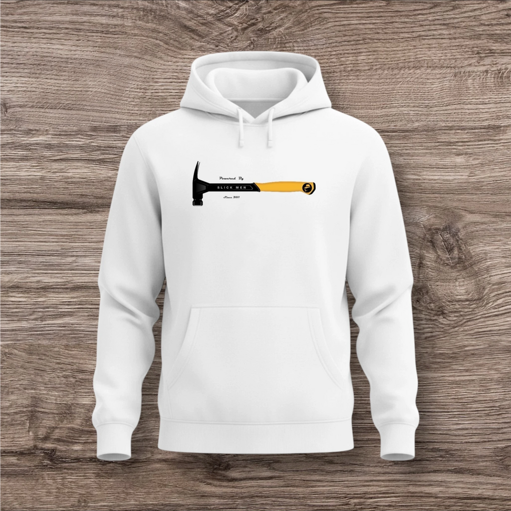 White hoodie with a hammer graphic and text on a wooden surface