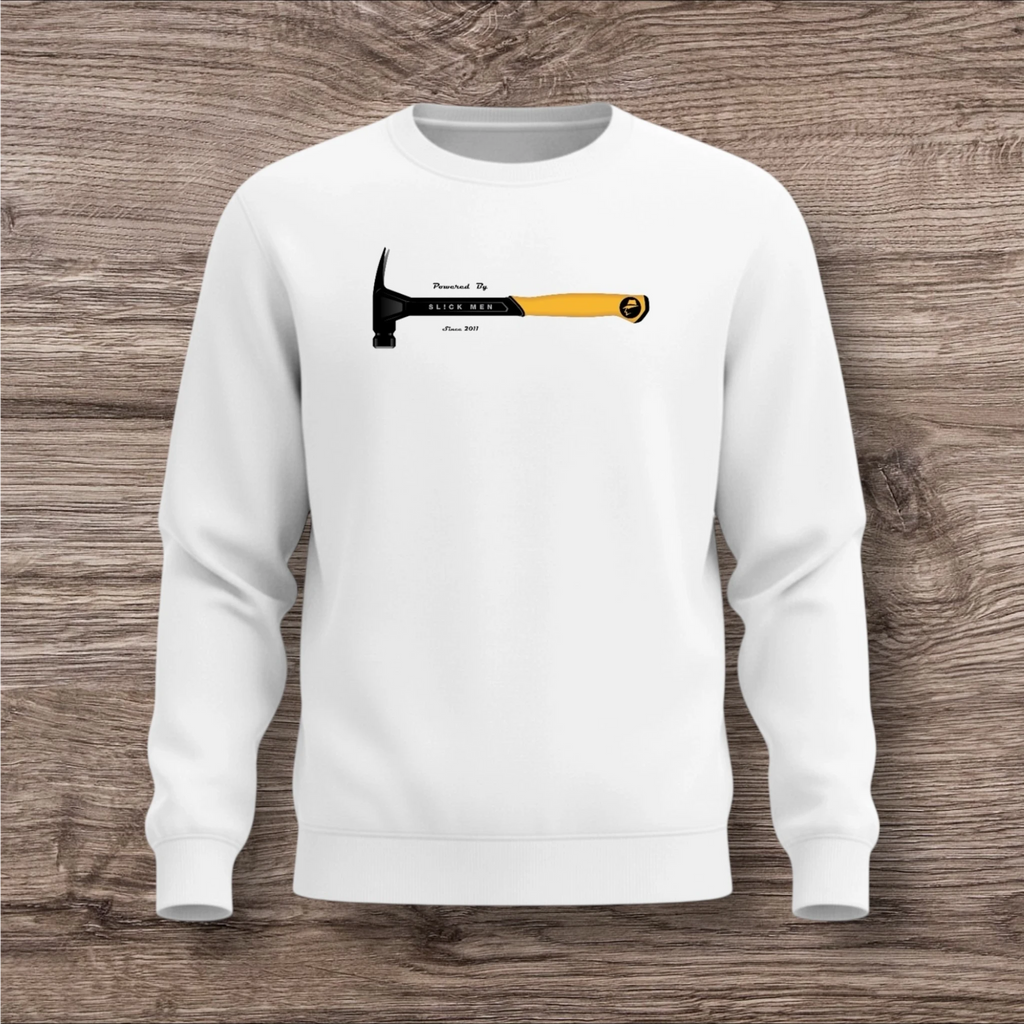 White sweatshirt with a hammer design on a wooden surface