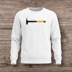 White sweatshirt with a hammer design on a wooden surface