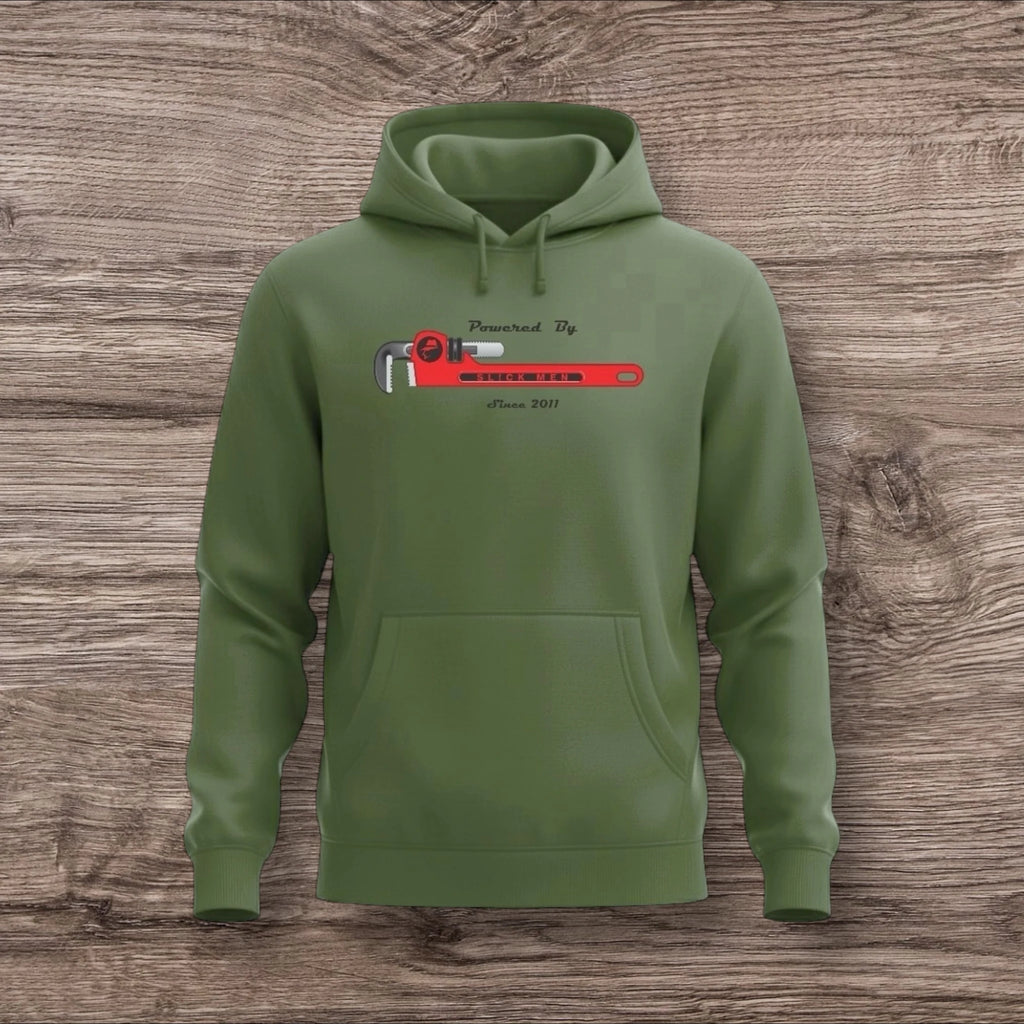 Army green hoodie with a plumber wrench on a wooden background