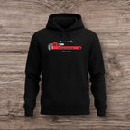 Black hoodie with a plumber wrench graphic on a wooden surface