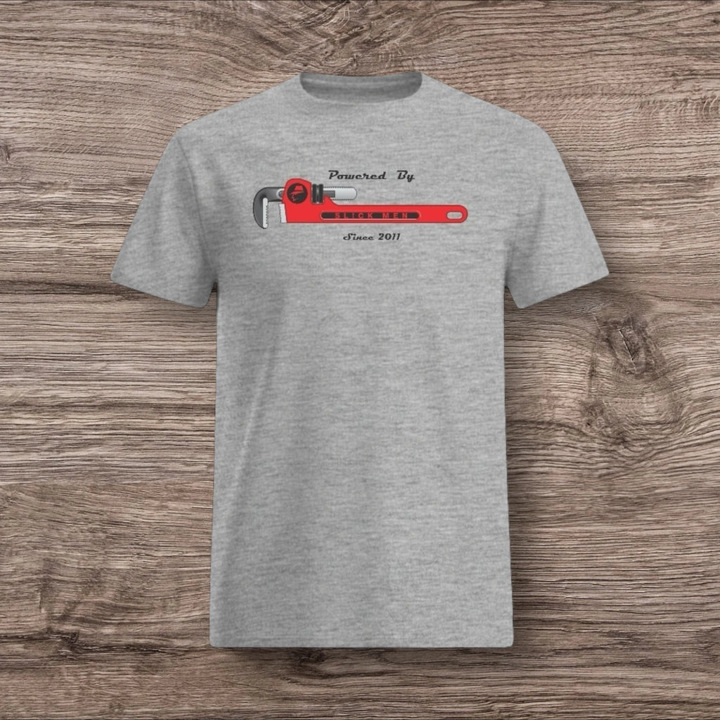 Sport gray t-shirt with a plumber wrench design on a wooden surface