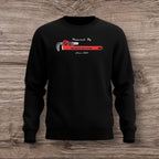 Black sweatshirt with a plumber wrench on a wooden surface