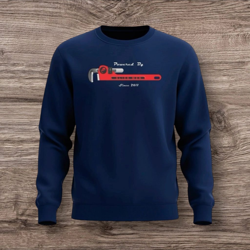 Navy blue sweatshirt with a plumber wrench design on a wooden surface