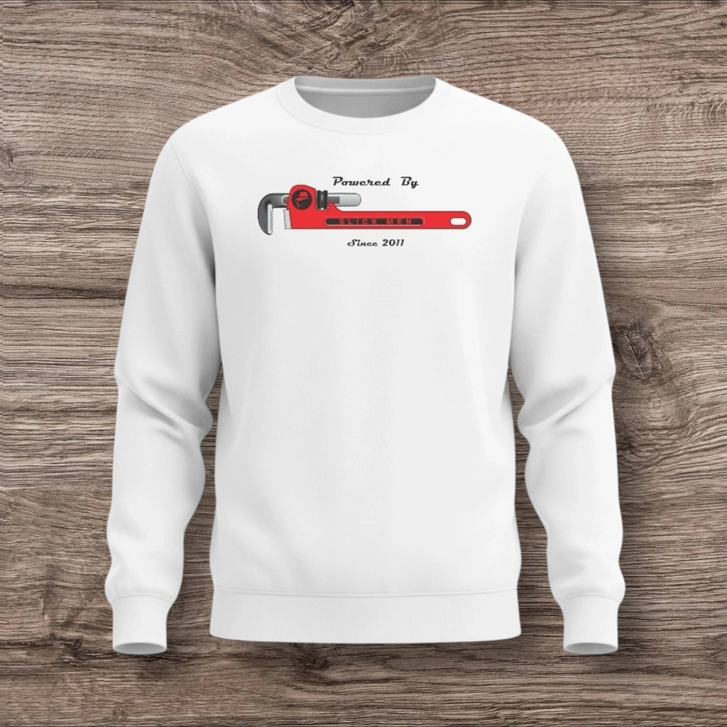 White sweatshirt with a plumber wrench on a wooden background