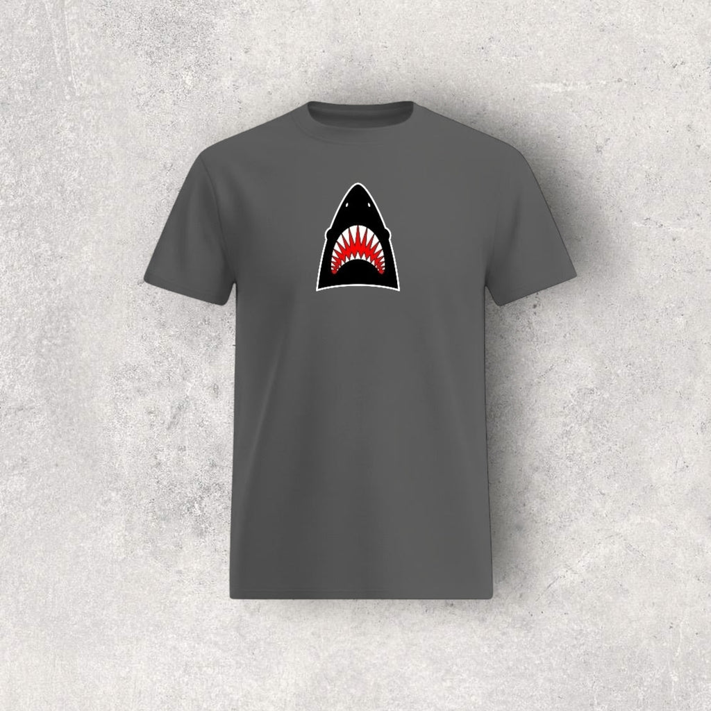 Gray t-shirt with a shark graphic on a textured gray background