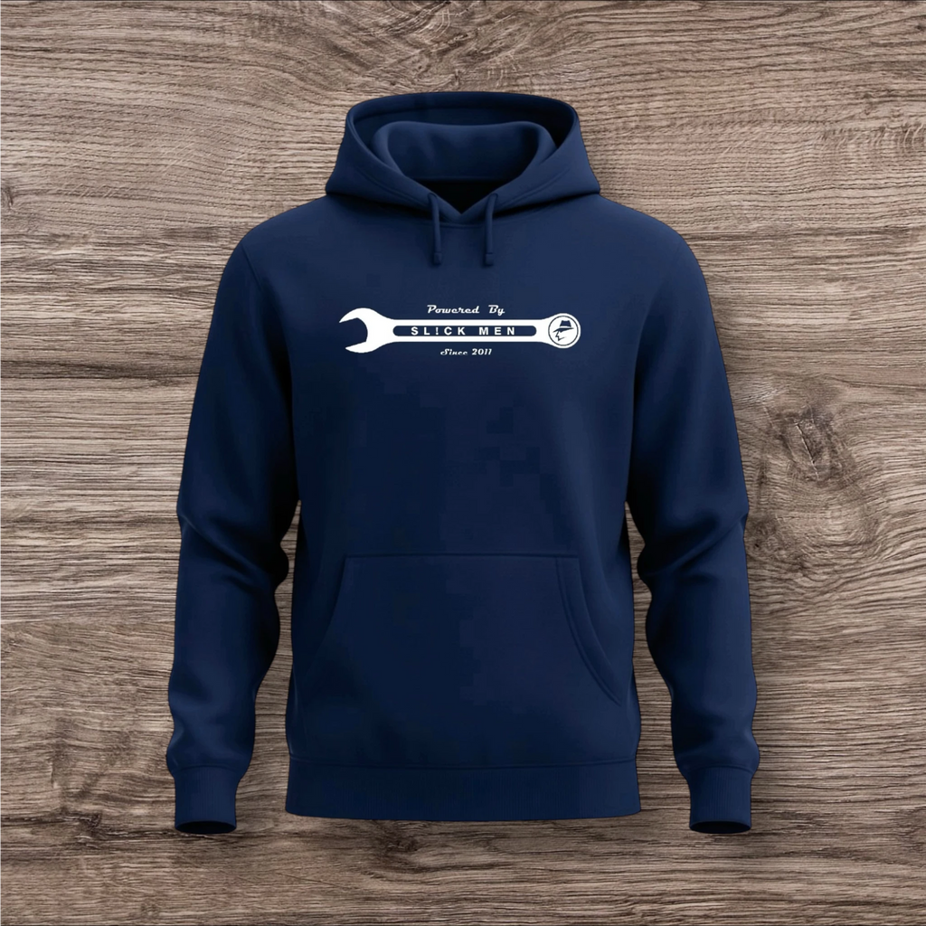 Navy blue hoodie with a white wrench graphic on a wooden surface