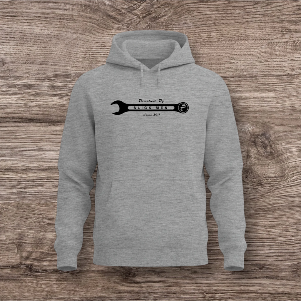 Gray hoodie with a black wrench graphic on a wooden surface