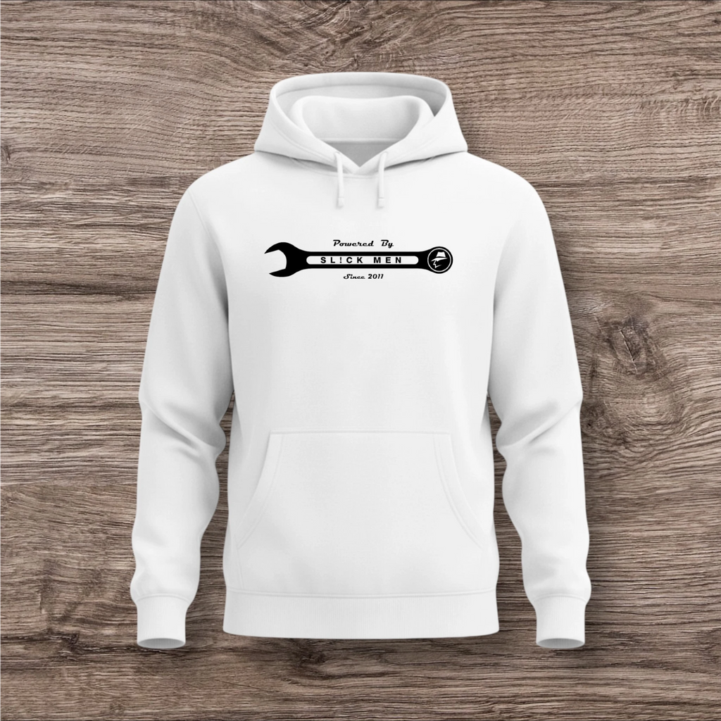 White hoodie with a black wrench graphic on a wooden surface