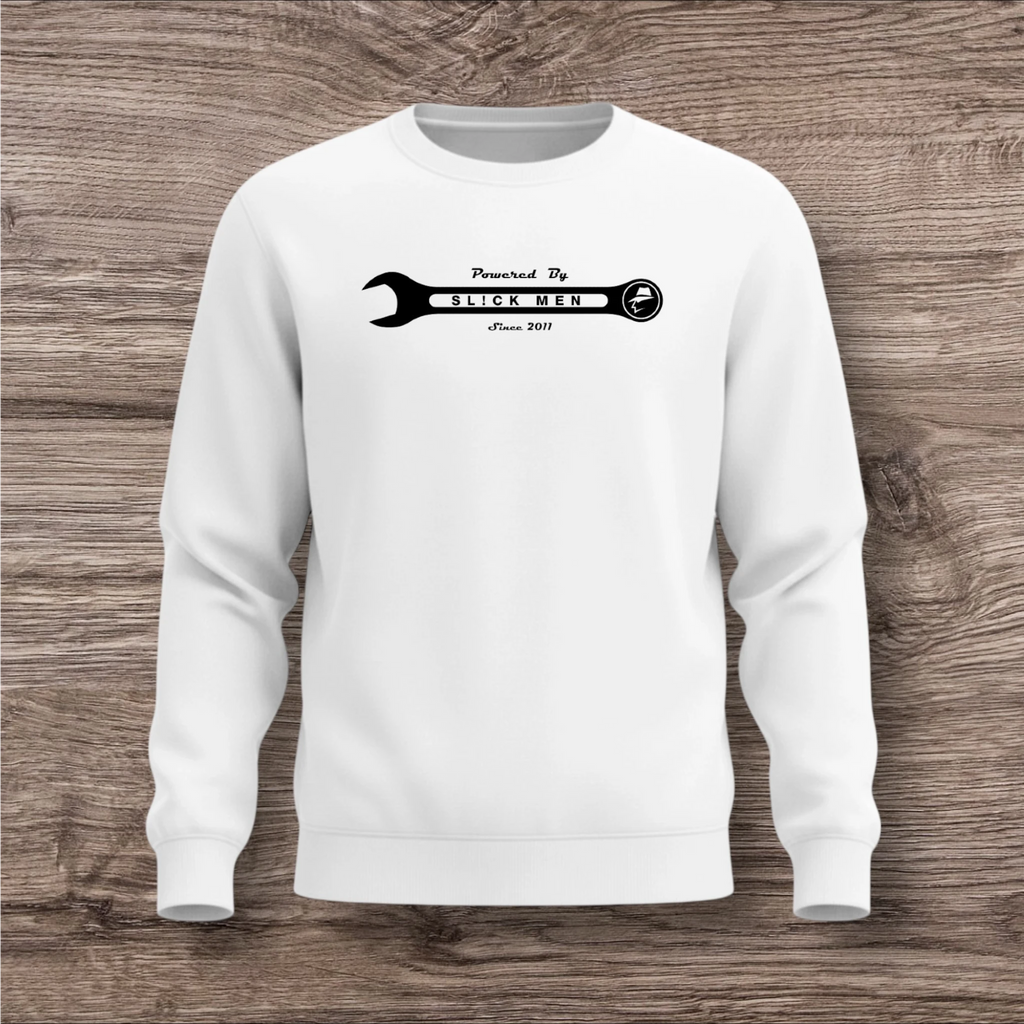 White sweatshirt with a black wrench graphic on a wooden surface