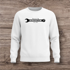 White sweatshirt with a black wrench graphic on a wooden surface